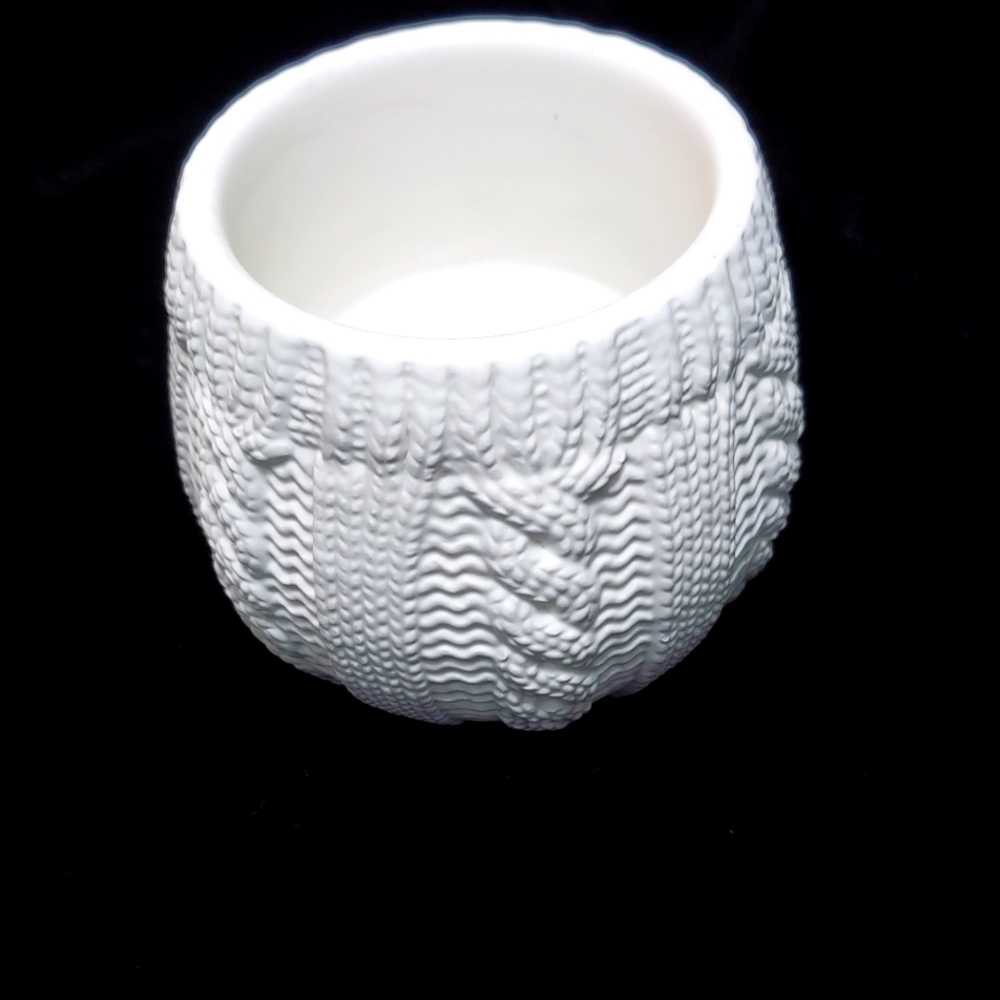 White Bath and Body Works filled candle holder.